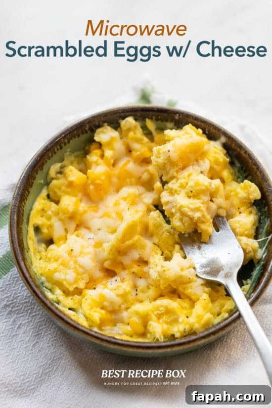 Microwave Scrambled Eggs Recipe | BestRecipeBox.com Microwave Scrambled Eggs Recipe in bowl with fork