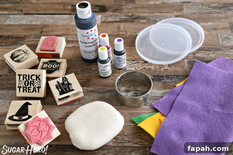 Stamped Halloween Cupcakes - ingredients needed to make stamped fondant circles, including fondant, food coloring, stamps, and felt | From SugarHero.com