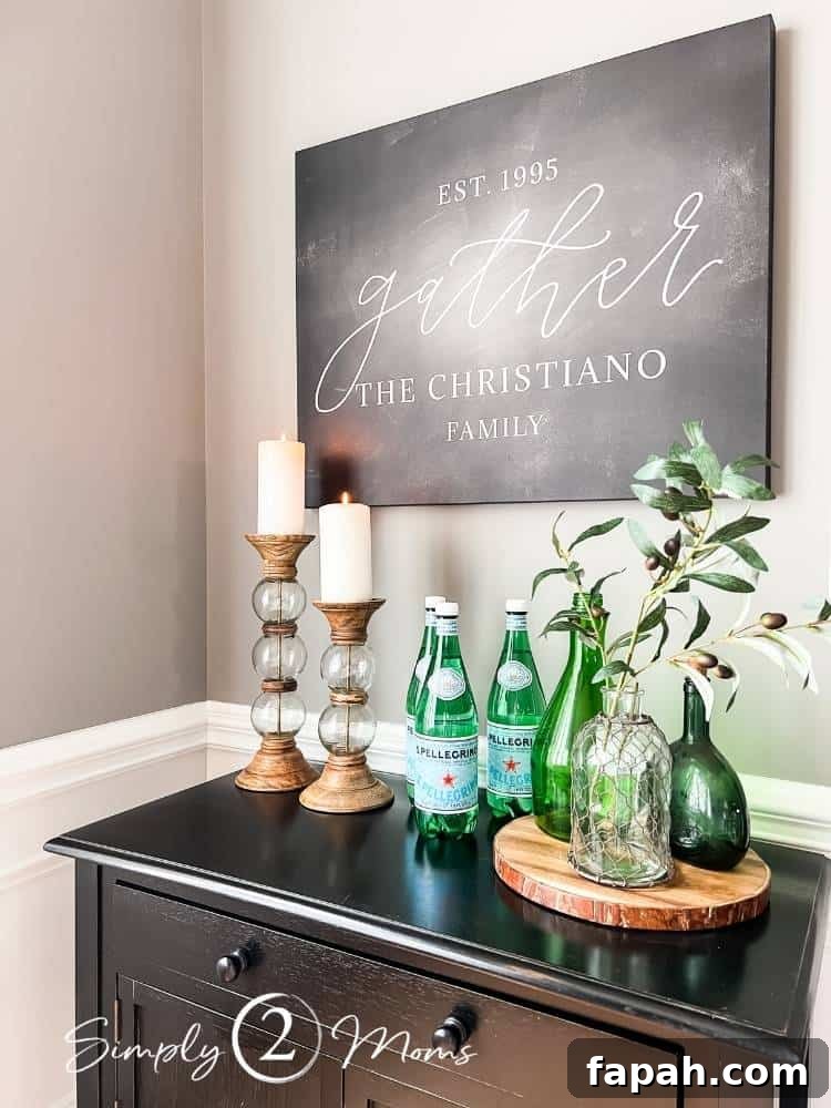 side board with word art above on wall
