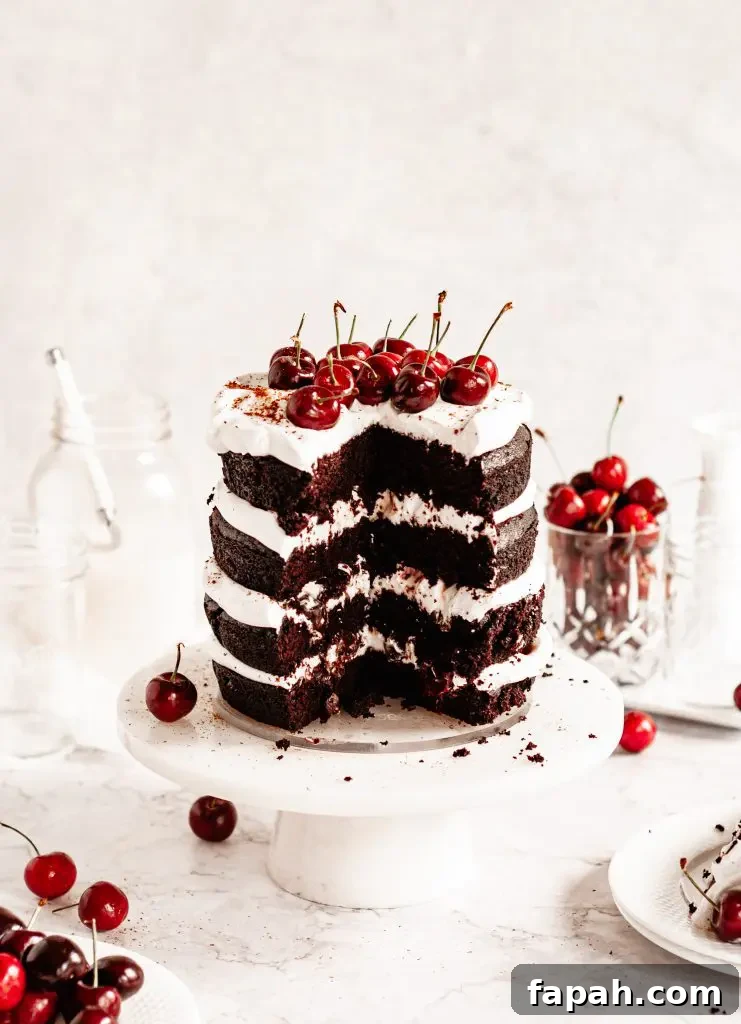 Four rich layers of dark chocolate cake. Whipped cream between each layer and topped with fresh cherries.
