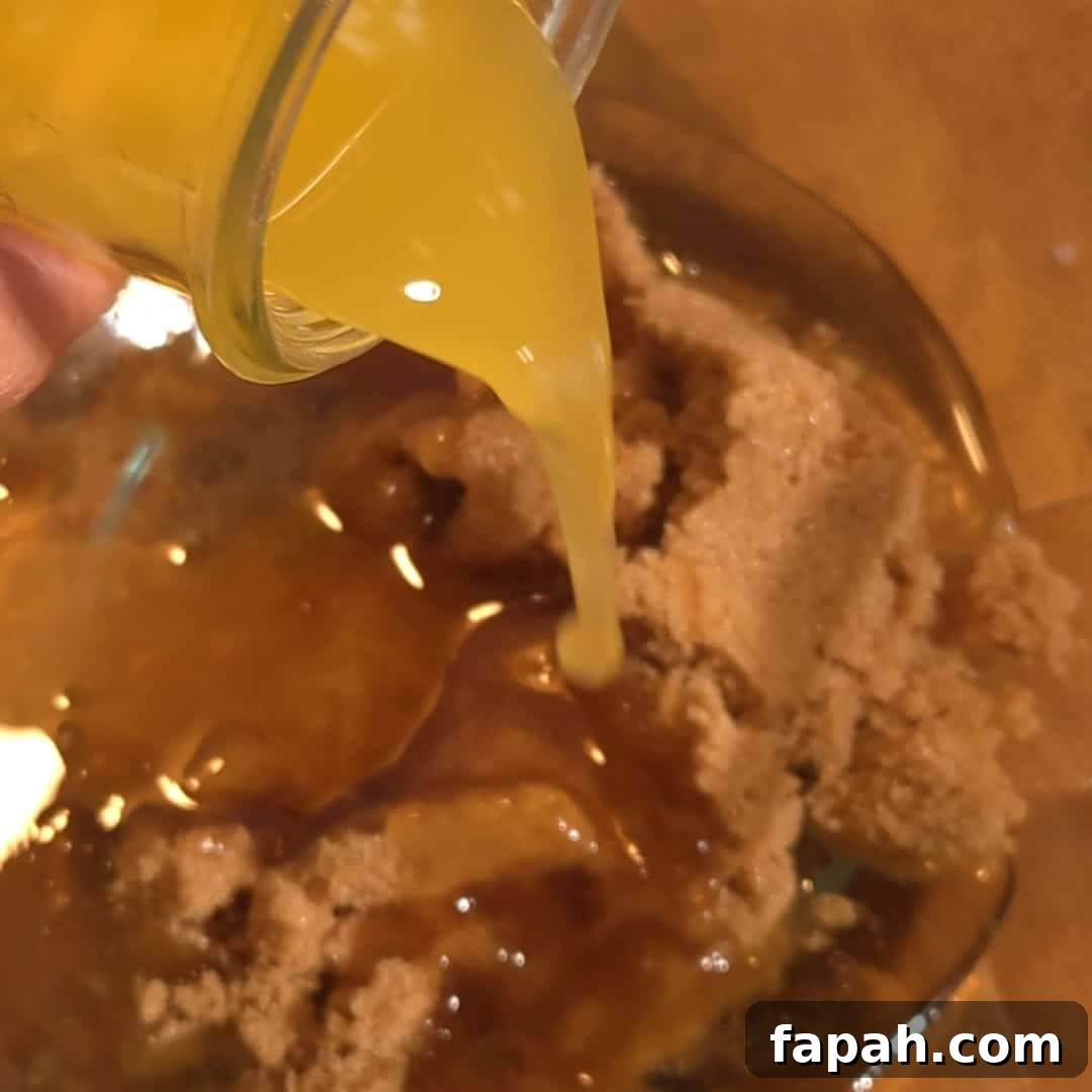 Chocolate Chip and Pecan Pie Recipe: Chocolate-Pecan Pie Guide 6 Pouring melted butter over brown sugar to make the rich filling for chocolate chip pecan pie.