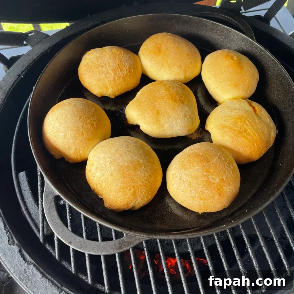 Cheesy Chicken Pot Pie Biscuit Recipe for Comfort Dinner 6 chicken pot pie biscuits in a cast iron skillet on the grill.