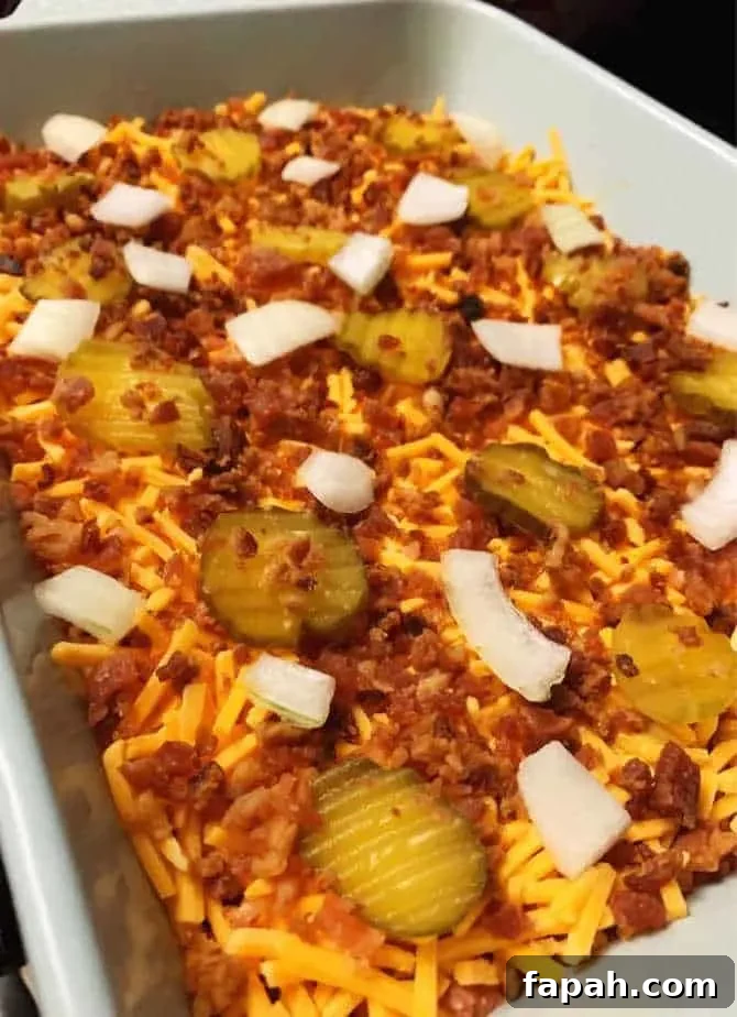 Keto Bacon Cheeseburger Casserole (Low-Carb Recipe) 5 top with cheese onion pickles