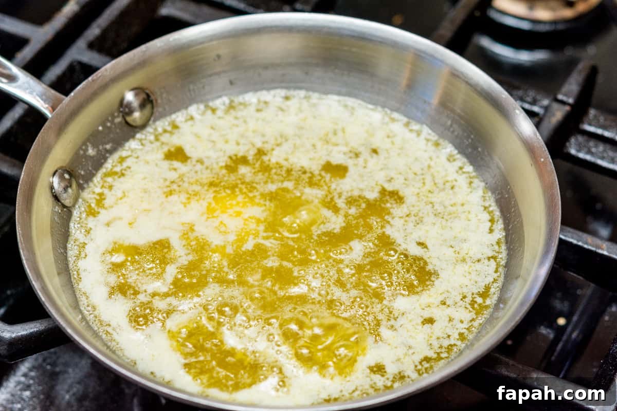 sizzling butter in small skillet