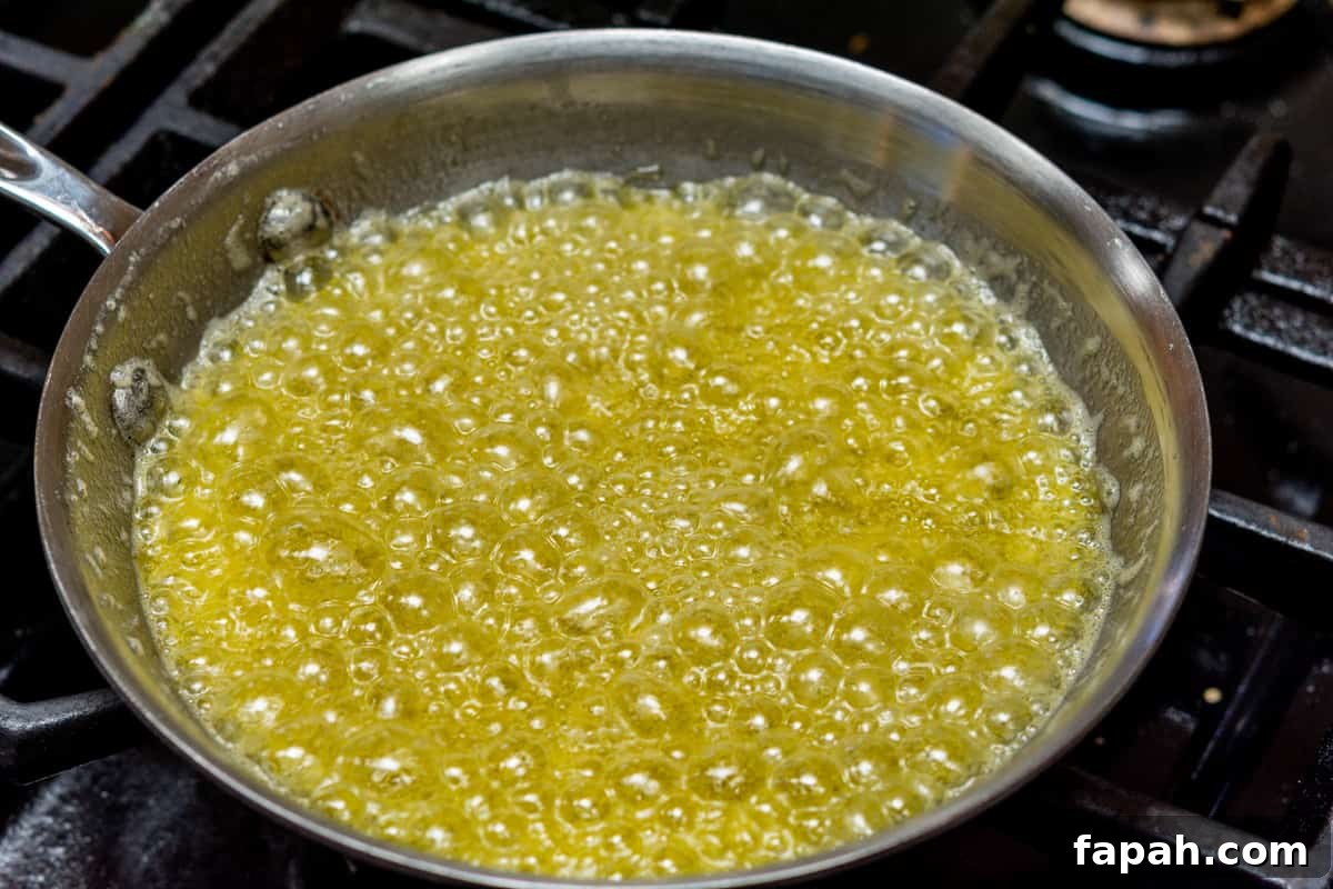 sizzling butter and garlic in skillet