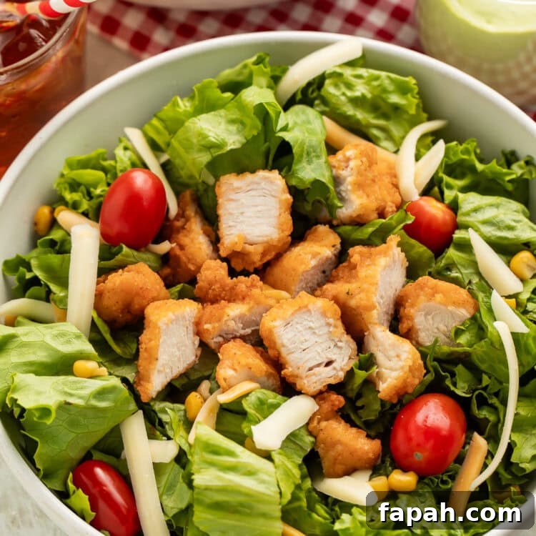 Chick-fil-A Cobb Salad Recipe: Classic Copycat Version 4 Chick-Fil-A cobb salad copycat in a bowl on a table.