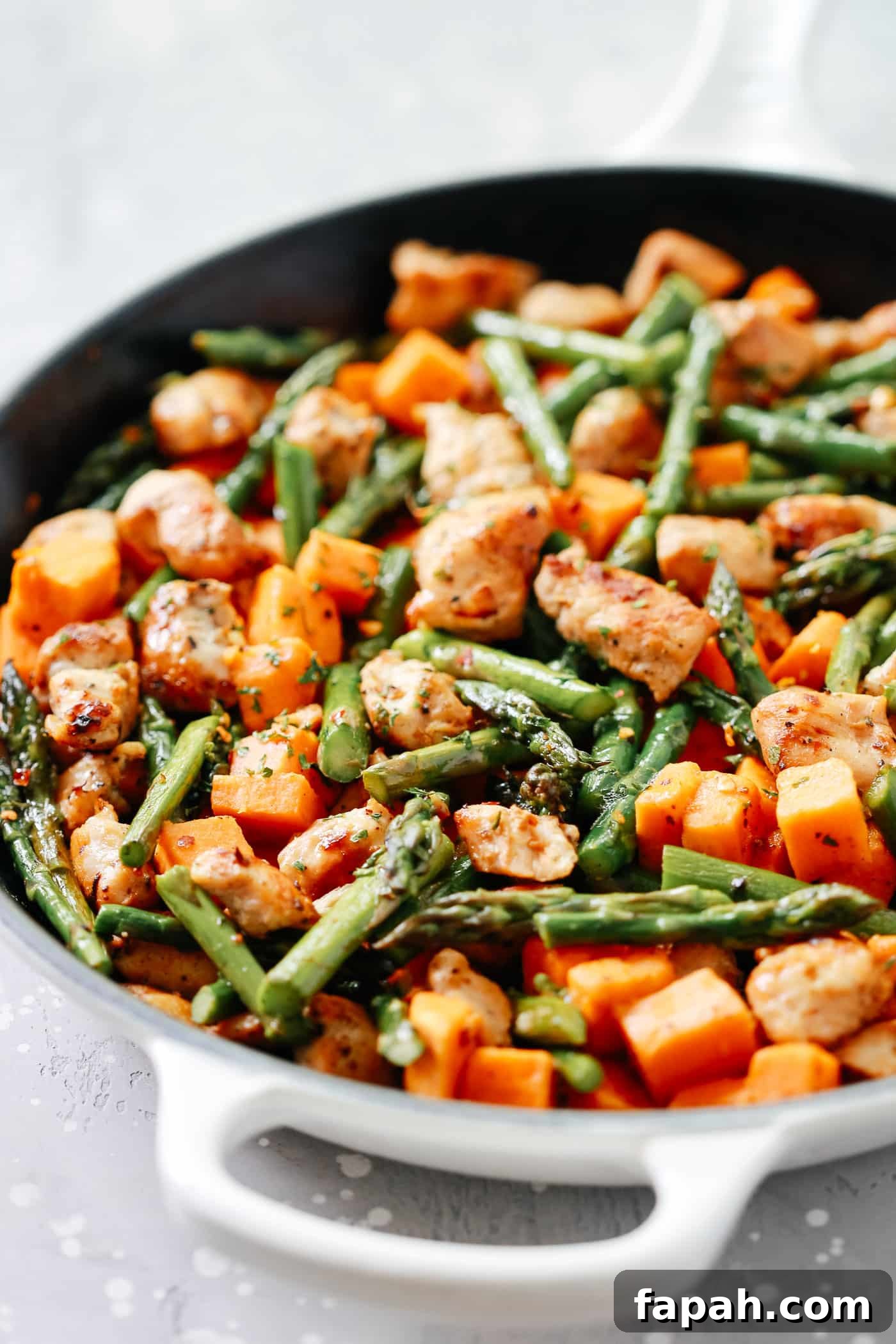 60 Delicious Whole30 Recipes for Every Meal and Snack 12 chicken and asparagus in a cast iron skillet