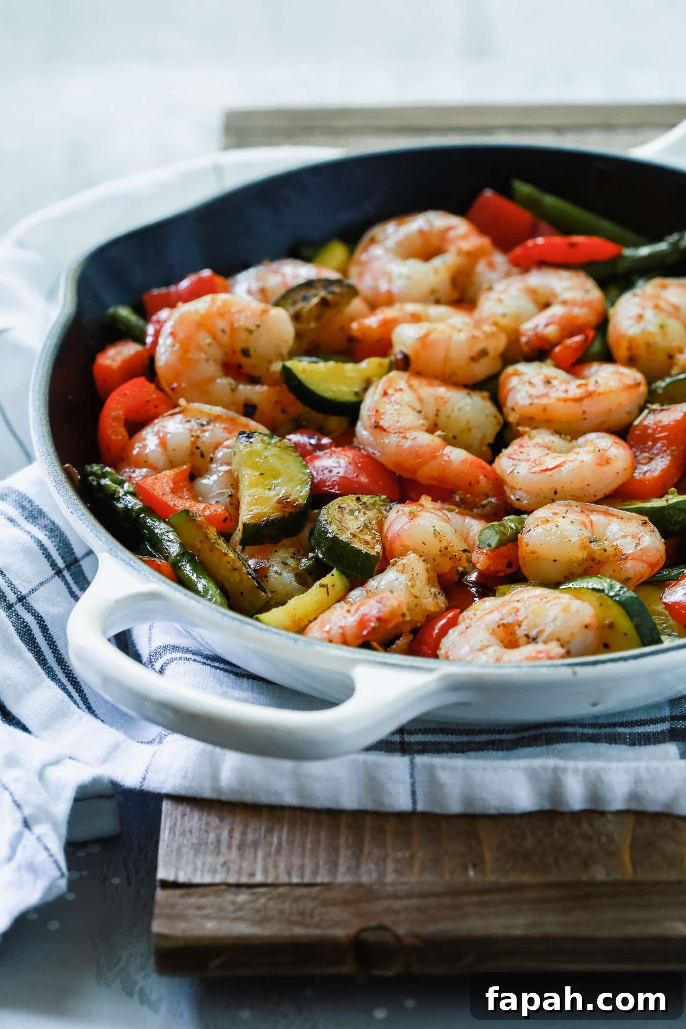 60 Delicious Whole30 Recipes for Every Meal and Snack 13 shrimp and veggies in a cast iron skillet