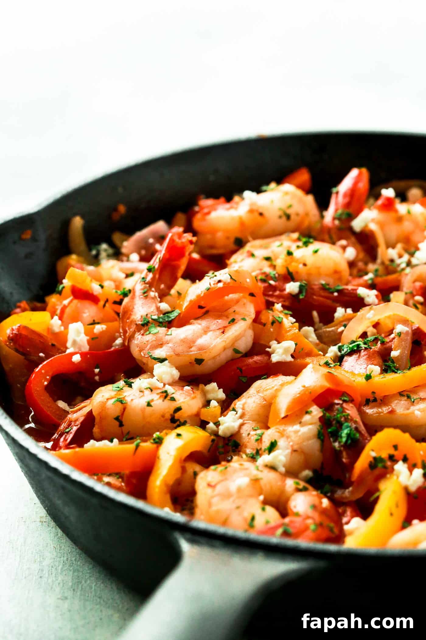 60 Delicious Whole30 Recipes for Every Meal and Snack 18 shrimp and bell pepper in a cast iron skillet