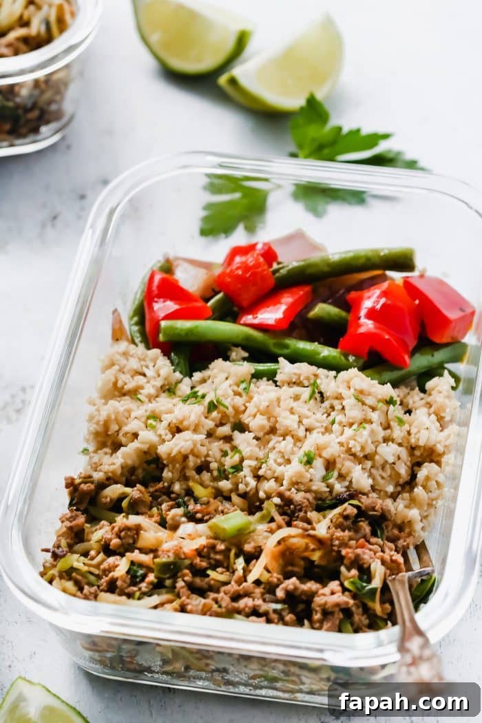 60 Delicious Whole30 Recipes for Every Meal and Snack 25 ground beef, green beans and cauliflower rice in a meal prep glass bowl