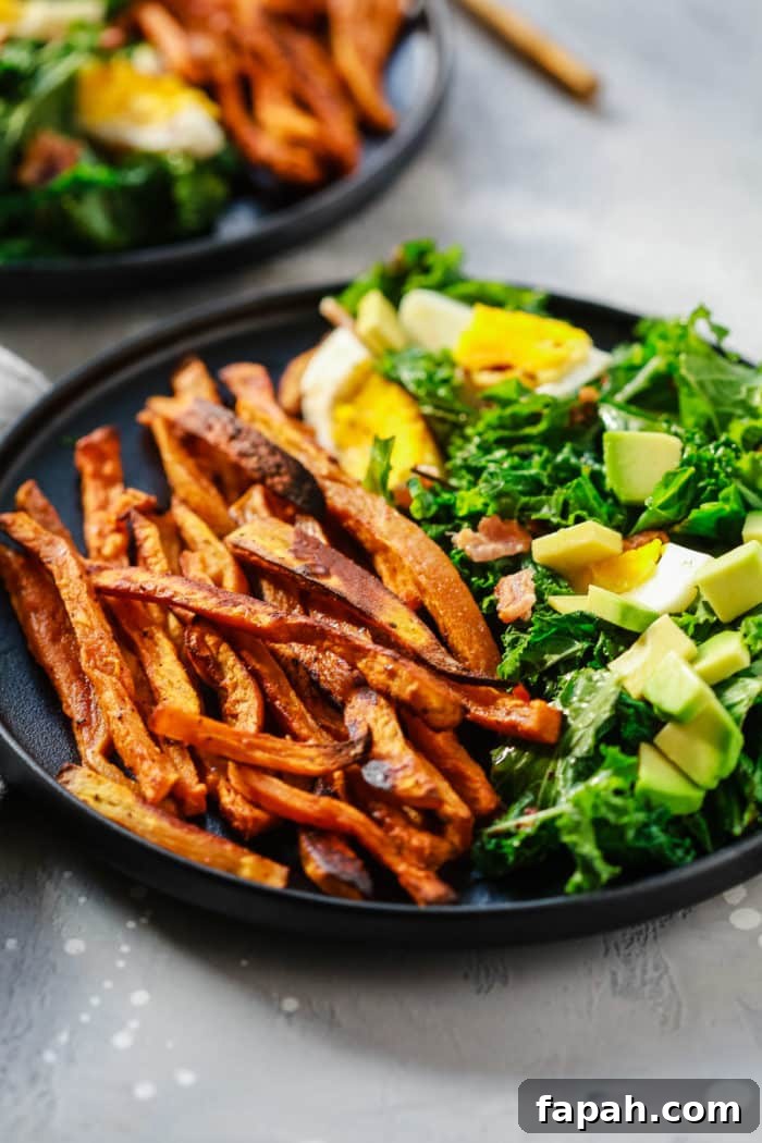 60 Delicious Whole30 Recipes for Every Meal and Snack 29 close-up kale salad on a black plate