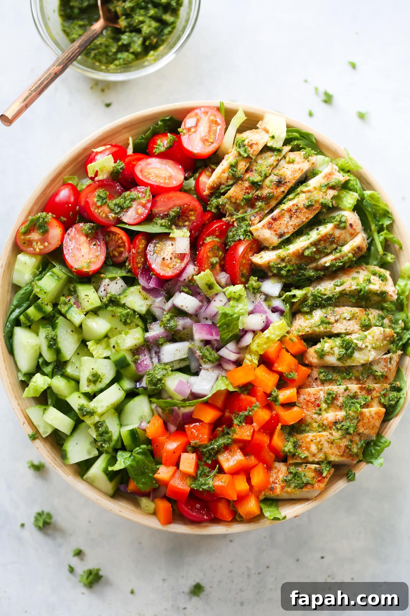 60 Delicious Whole30 Recipes for Every Meal and Snack 40 overhead view of a chimichurri chicken chopped Salad bowl