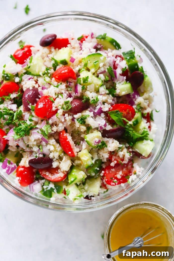 60 Delicious Whole30 Recipes for Every Meal and Snack 41 overhead view of cauliflower salad in a glass bowl