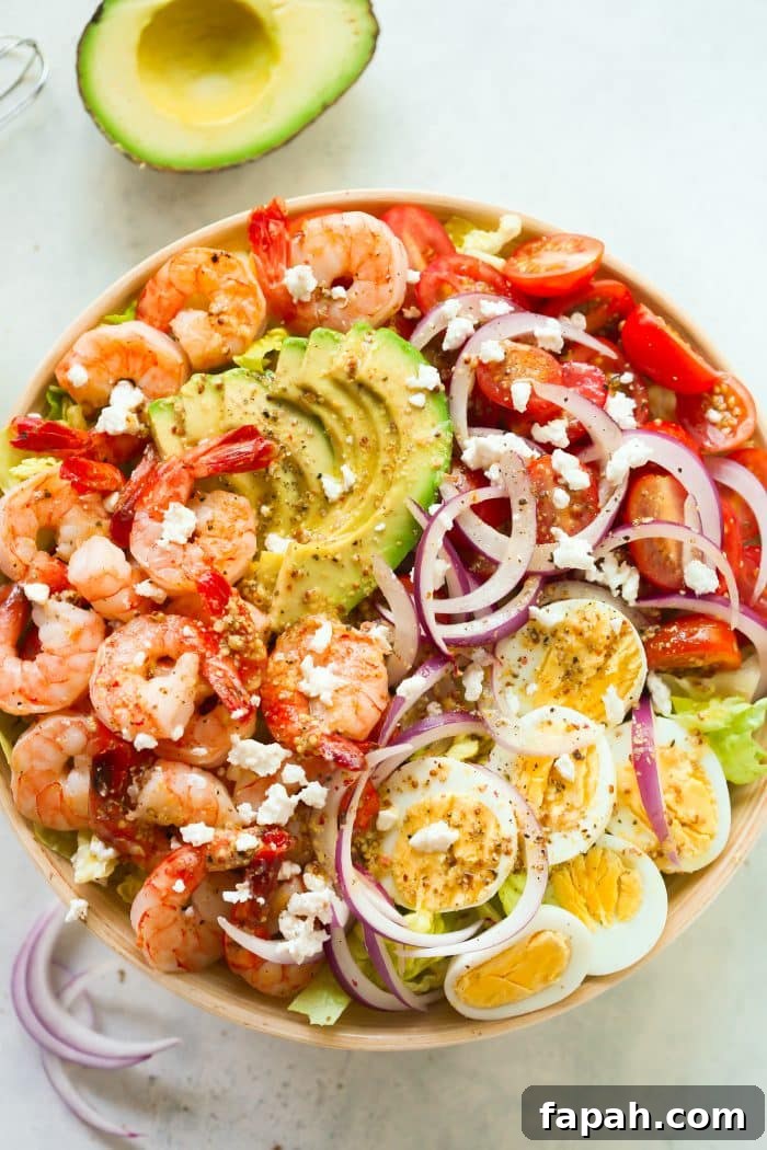 60 Delicious Whole30 Recipes for Every Meal and Snack 42 overhead view of shrimp salad in a wooden bowl