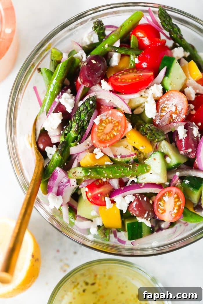 60 Delicious Whole30 Recipes for Every Meal and Snack 43 overhead view of asparagus salad in a glass bowl