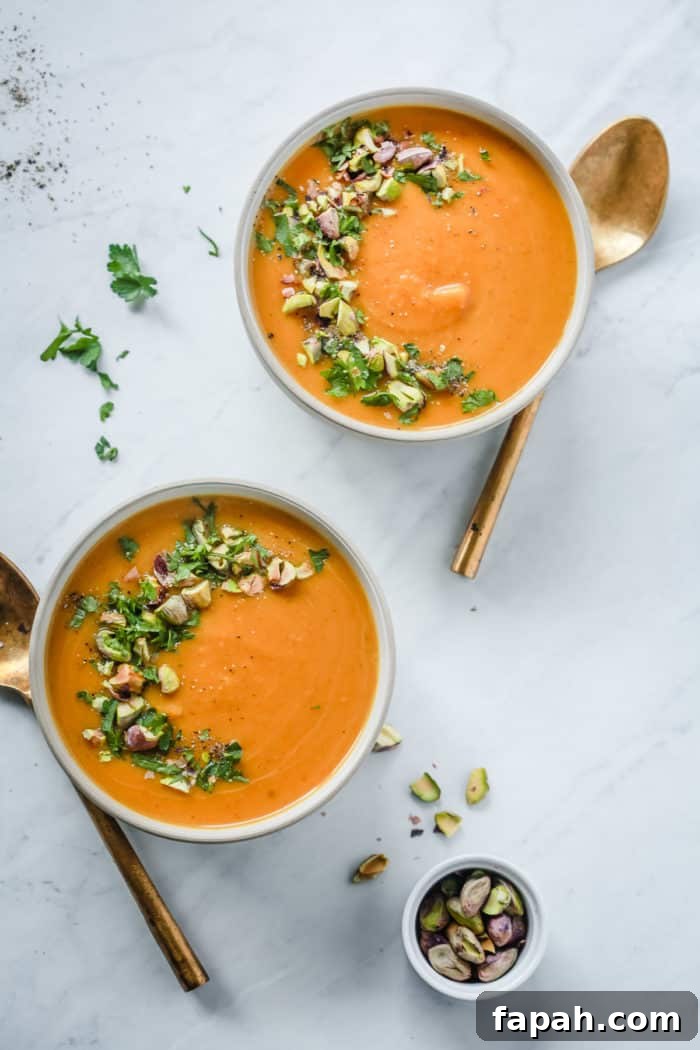 60 Delicious Whole30 Recipes for Every Meal and Snack 49 overhead view of butternut squash soup in a grey bowl