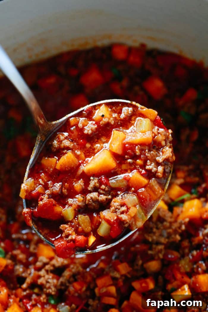 60 Delicious Whole30 Recipes for Every Meal and Snack 50 Close-up of a ladle with butternut squash chili.