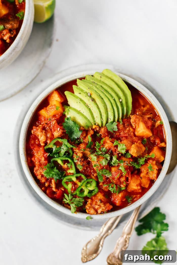 60 Delicious Whole30 Recipes for Every Meal and Snack 52 overhead view of sweet potato chili in a grey bowl