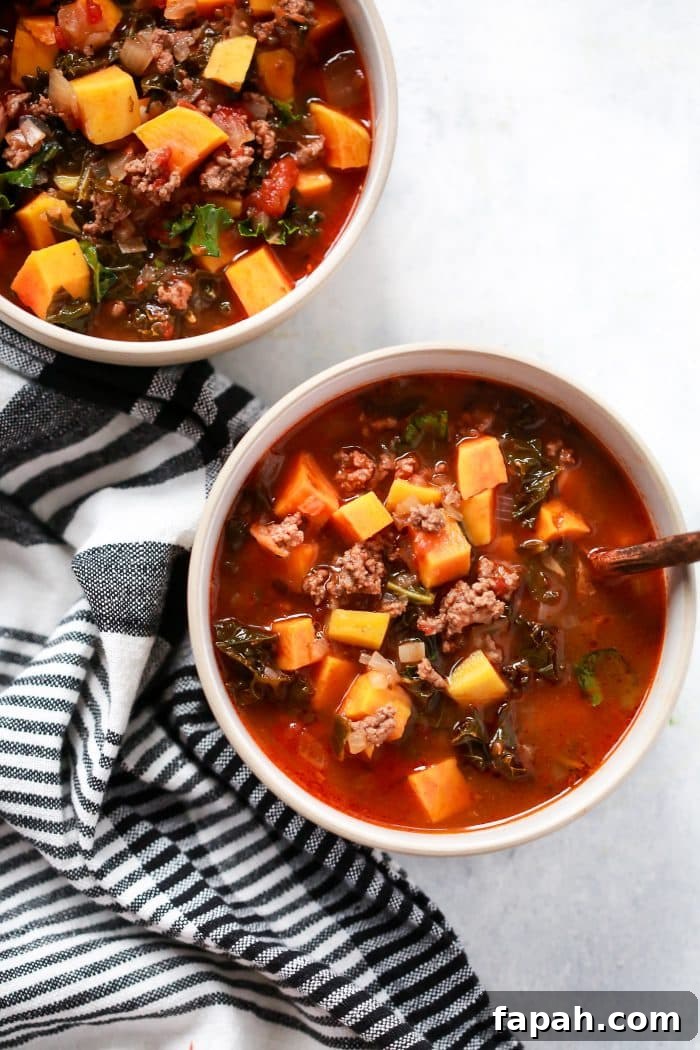 60 Delicious Whole30 Recipes for Every Meal and Snack 53 overhead view of sausage and butternut soup in a white bowl