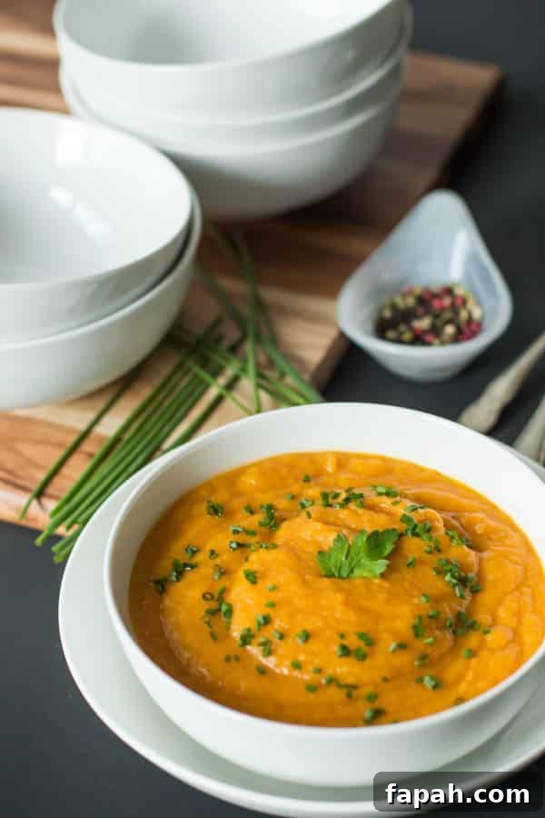 60 Delicious Whole30 Recipes for Every Meal and Snack 56 Carrot and Parnisp soup in a white bowl