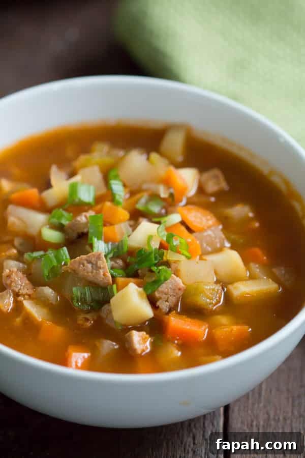 60 Delicious Whole30 Recipes for Every Meal and Snack 57 close-up of a sausage and vegetable soup in a white bowl