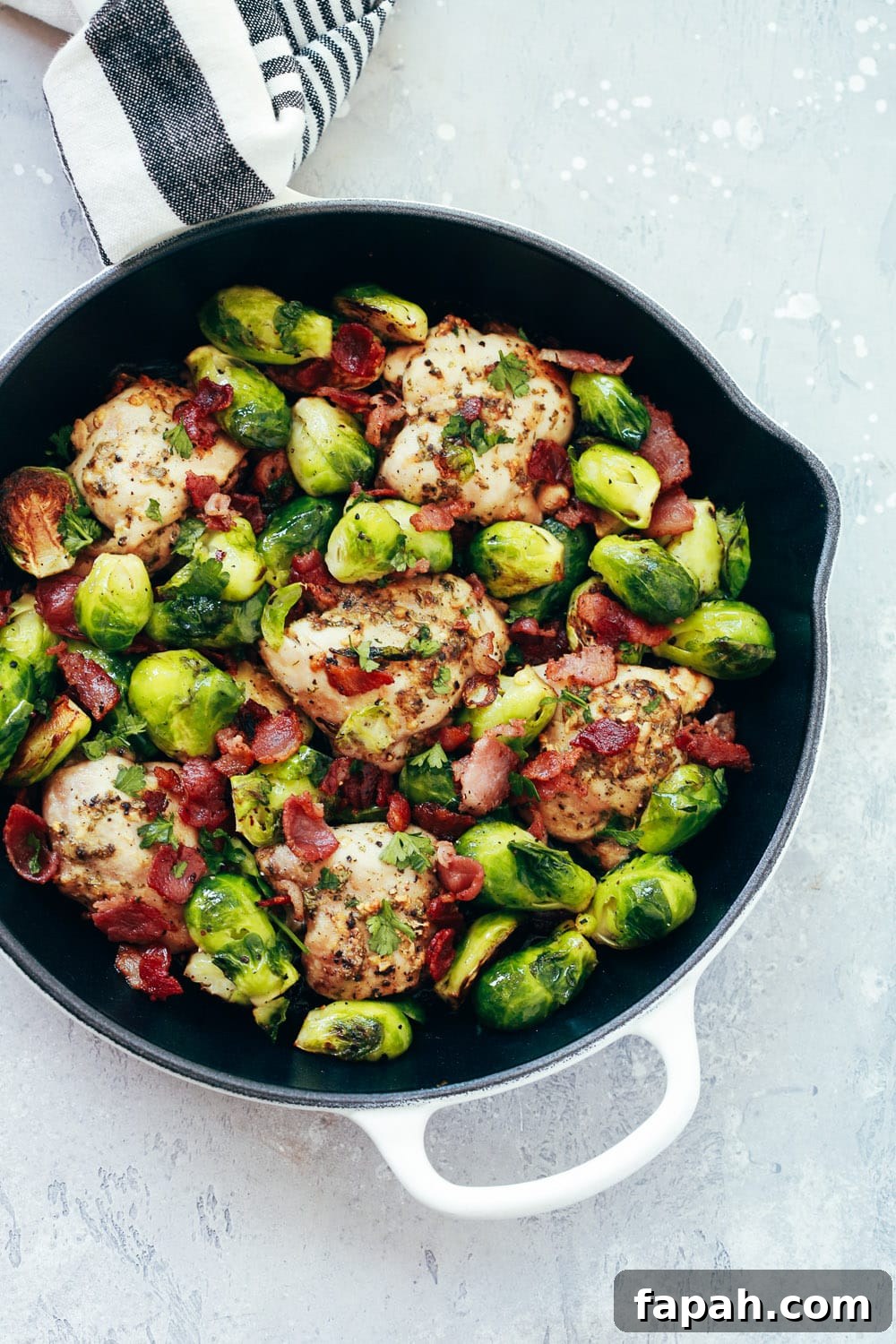60 Delicious Whole30 Recipes for Every Meal and Snack 7 close up of a cast iron skillet containing Chicken and Brussels sprout