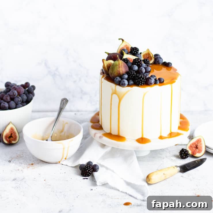 sweet potato cake next to an empty bowl of caramel and a bowl of grapes