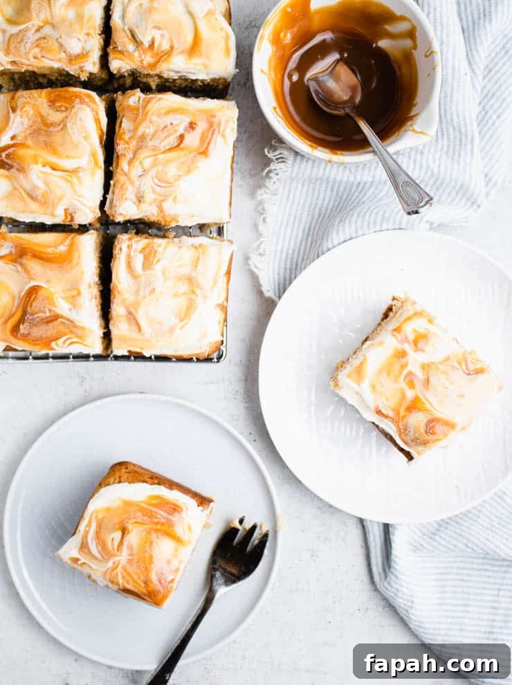 overhead view of caramel apple cake on a cooling rack with plated slices of cake and a bowl of caramel around it.