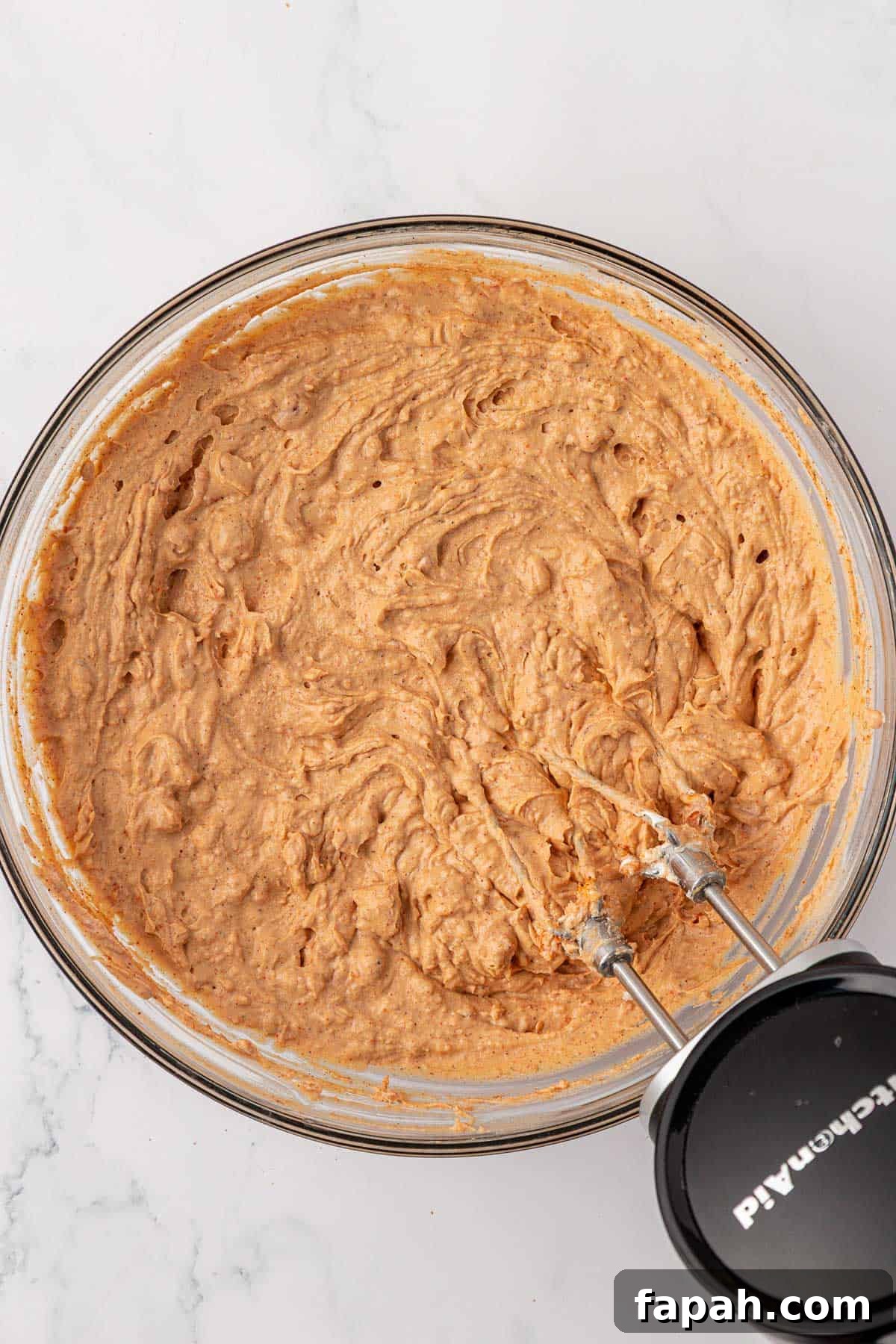 mixing the bean dip ingredients together