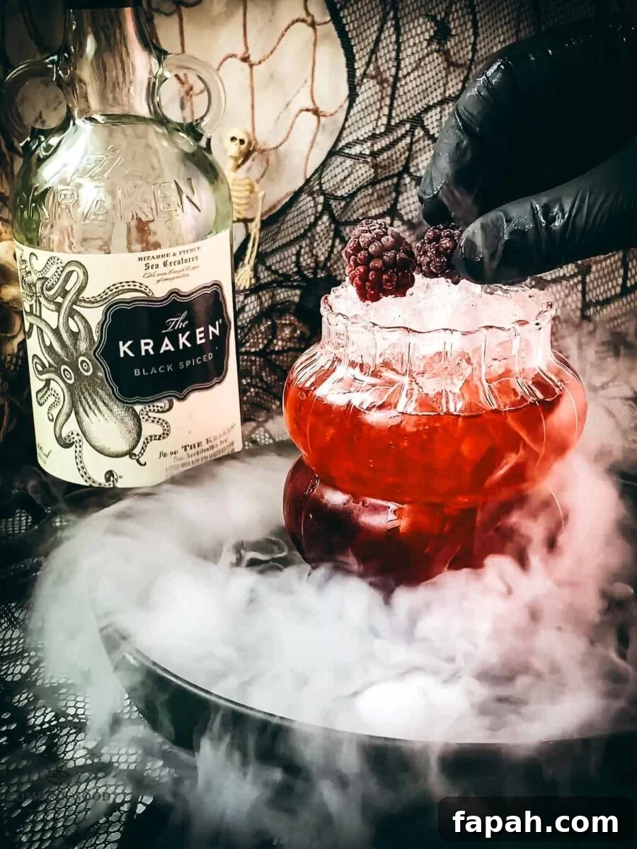 Garnish the cocktail with frozen blackberries.
