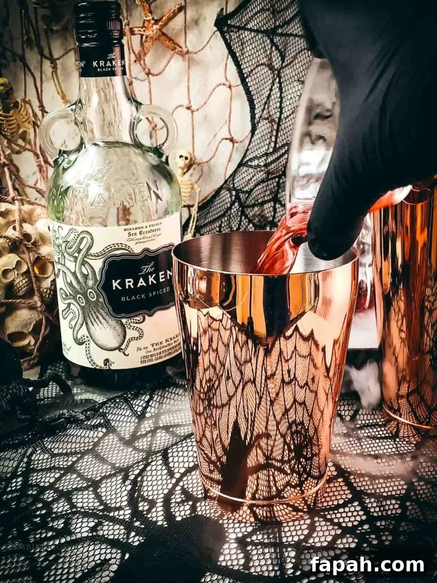 Add cranberry juice to the cocktail shaker tin.