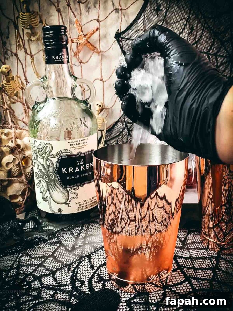 Add crushed ice to the cocktail shaker tin.