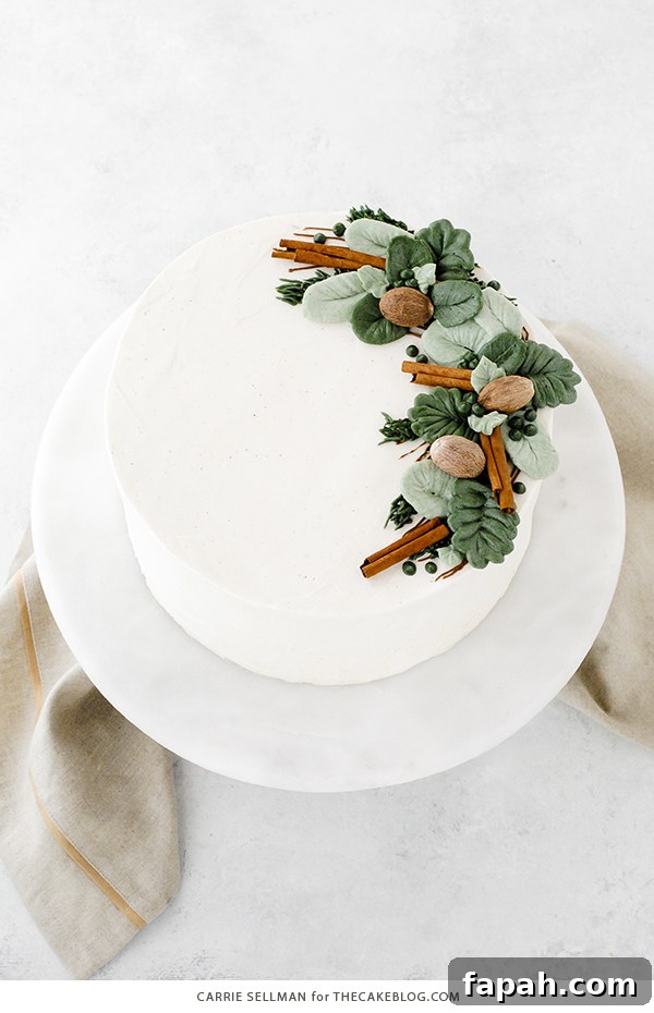Decadent Eggnog Layer Cake with Spiced Rum Glaze 3 Eggnog Cake - a rich butter cake with hints of cinnamon and nutmeg, paired with a creamy eggnog buttercream | by Carrie Sellman for TheCakeBlog.com
