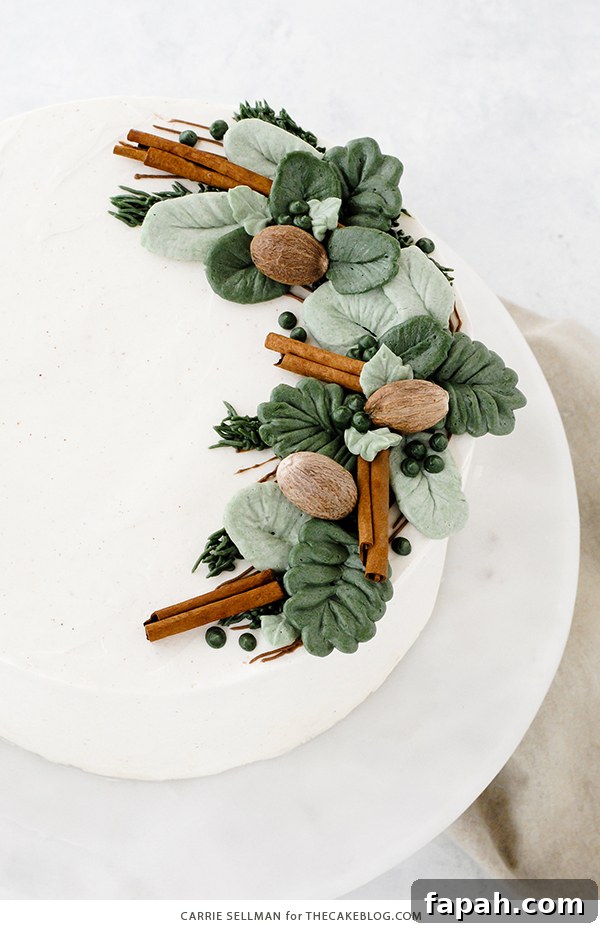 Decadent Eggnog Layer Cake with Spiced Rum Glaze 4 Eggnog Cake - a rich butter cake with hints of cinnamon and nutmeg, paired with a creamy eggnog buttercream | by Carrie Sellman for TheCakeBlog.com