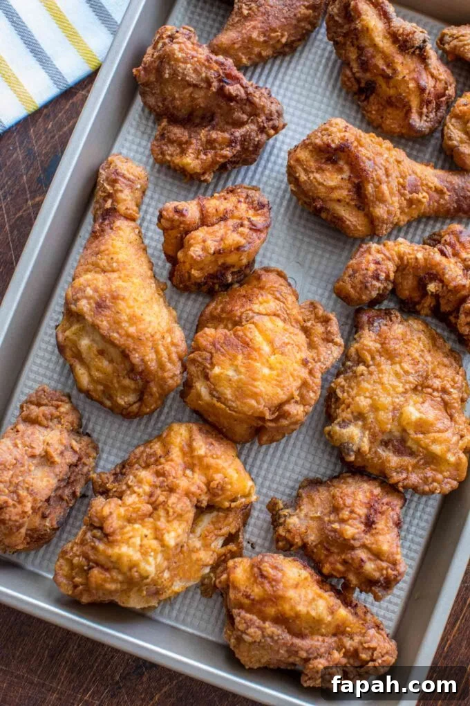 Crispy Southern-Style Fried Chicken Recipe for Perfect Crunch 2 A tray with homemade crispy fried chicken.