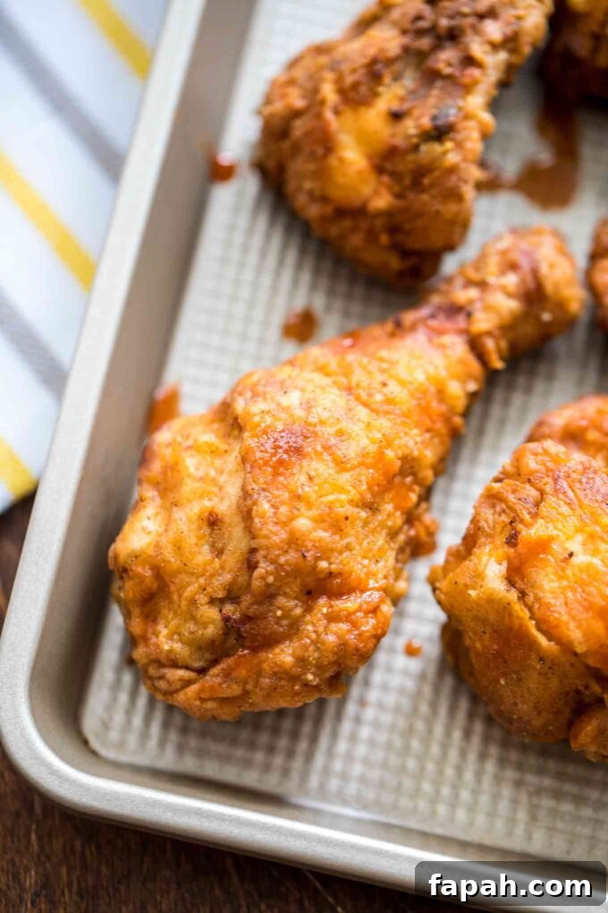 Crispy Southern-Style Fried Chicken Recipe for Perfect Crunch 14 Homemade fried chicken on a tray.