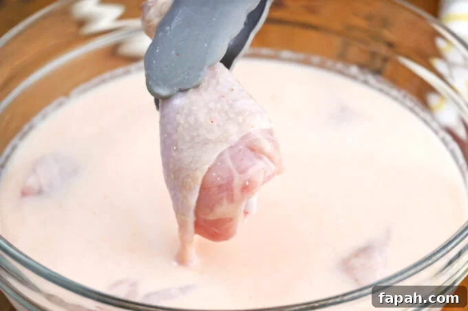 Crispy Southern-Style Fried Chicken Recipe for Perfect Crunch 6 Brining chicken pieces in buttermilk.
