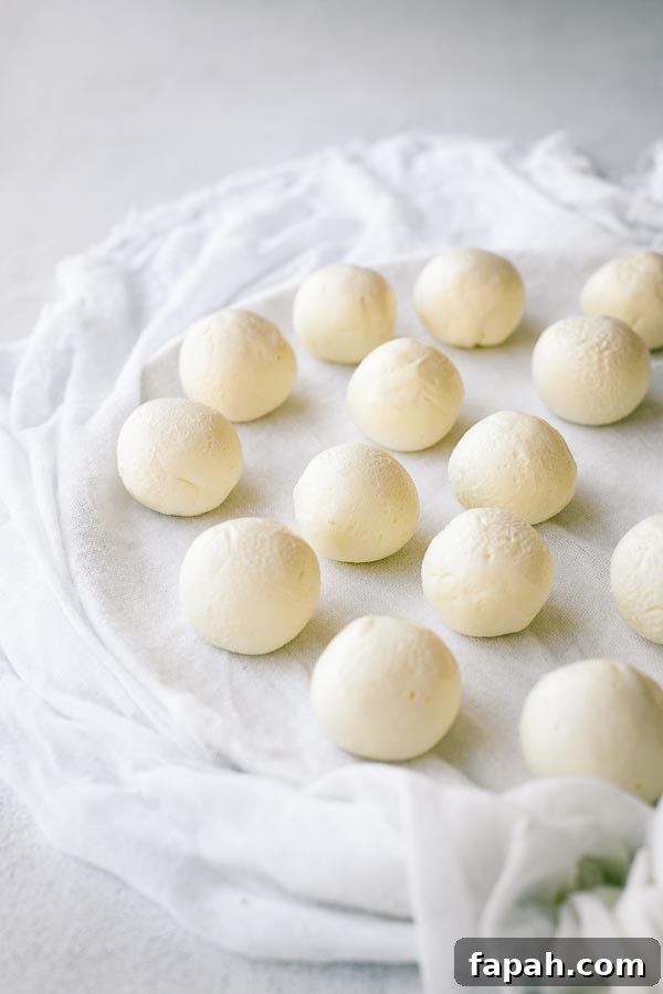 Plain labneh balls on muslin.