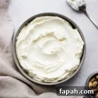 Homemade labneh cheese in a shallow bowl viewed from above.