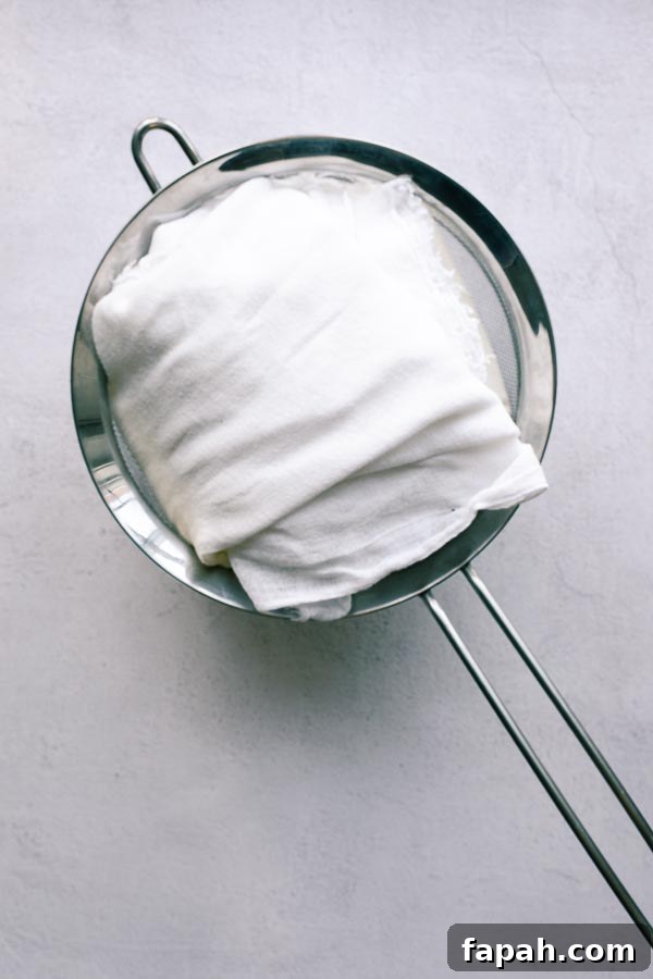 Yoghurt wrapped in muslin ready to be strained.
