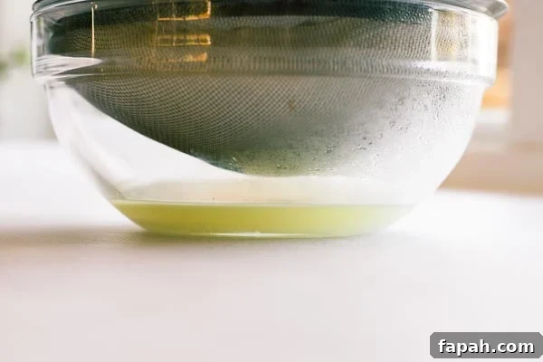Whey being strained from yoghurt while making labneh.