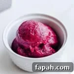 35 Gluten-Free Valentine’s Day Desserts to Delight Your Loved One 12 Pink sorbet in a small white bowl.