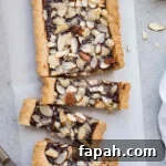 35 Gluten-Free Valentine’s Day Desserts to Delight Your Loved One 17 A tart filled with jam and topped with almonds.