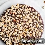 35 Gluten-Free Valentine’s Day Desserts to Delight Your Loved One 18 A chocolate tart with hazelnuts on top.