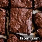 35 Gluten-Free Valentine’s Day Desserts to Delight Your Loved One 28 Freshly cut chocolate brownies on white parchment paper.