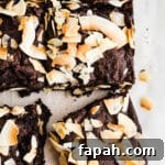 35 Gluten-Free Valentine’s Day Desserts to Delight Your Loved One 29 Chocolate brownies with toasted coconut on top on parchment paper.