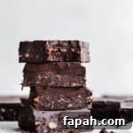 35 Gluten-Free Valentine’s Day Desserts to Delight Your Loved One 31 Fudgy brownies stacked on top of each other.
