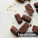 35 Gluten-Free Valentine’s Day Desserts to Delight Your Loved One 40 Chocolate crunch bars spread out on table.