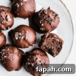 35 Gluten-Free Valentine’s Day Desserts to Delight Your Loved One 42 Oreo truffle balls on a white plate.