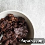 A white bowl filled with chocolate pudding cake.